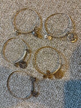 Alex and Ani bundle, one gold and four silver Bangle Bracelets